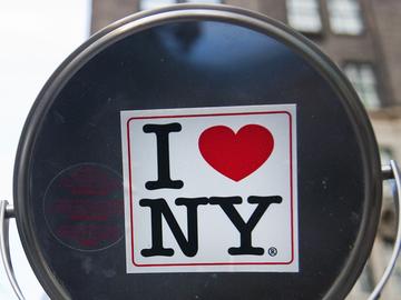 An 'I heart NY' sticker on a vendor's mirror near Central Park.