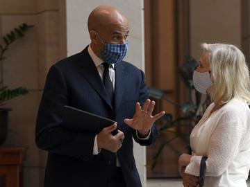 Sen. Cory Booker, D-N.J.,, left, talks with Sen. Kirsten Gillibrand, D-N.Y., following a moment of silence on Capitol Hill in Washington, Thursday, June 4, 2020, to commemorate the life of George Floy