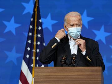 Democratic presidential candidate former Vice President Joe Biden removes his face mask to speak Thursday, Nov. 5, 2020, in Wilmington, Del. 
