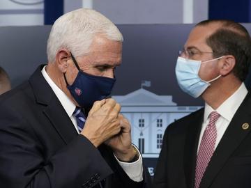 Vice President Mike Pence, left, and Health and Human Services Secretary Alex Azar, right, participate in a briefing with the coronavirus task force at the White House in Washington, Thursday, Nov. 19