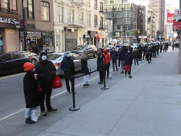 People line up outside a CityMD urgent care clinic offering COVID-19 testing in the borough of Manhattan in New York City on Thursday, November 19, 2020.