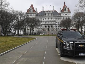 New York State Police patrol the grounds of the state Capitol in Albany, N.Y. in January, 2021.