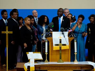 Attorney Benjamin Crump, accompanied by the family of Ruth Whitfield, a victim of shooting at a supermarket, speaks with members of the media during a news conference in Buffalo, N.Y., Monday, May 16,