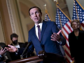 Sen. Chris Murphy, D-Conn., speaks to reporters outside the chamber to answer questions about his efforts to reach a bipartisan Senate agreement to rein in gun violence, at the Capitol in Washington, 