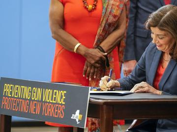 New York Gov. Kathy Hochul signs a package of bills to strengthen gun laws, June 6, 2022, in New York. The Supreme Court, Thursday, June 23, 2022, struck down a restrictive New York gun law in a major