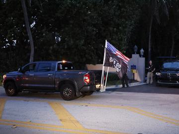Supporters of former President Donald Trump drive past his Mar-a-Lago estate, Monday, Aug. 8, 2022, in Palm Beach, Fla. Trump said in a lengthy statement that the FBI was conducting a search of his Ma