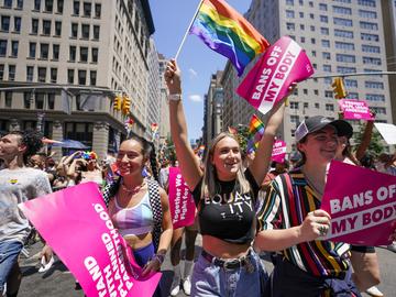 Revelers with Planned Parenthood march down Fifth Avenue during the annual NYC Pride March, on June 26, 2022, in New York.