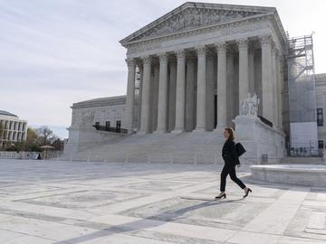 Attorney Lisa Blatt, of Williams & Connolly LLP, walks as she poses for a photograph in front of the Supreme Court, Monday, April 8, 2024, in Washington.