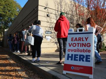 People wait in line for early voting for the midterm elections at Ponce De Leon Library on November 04, 2022 in Atlanta, Georgia.