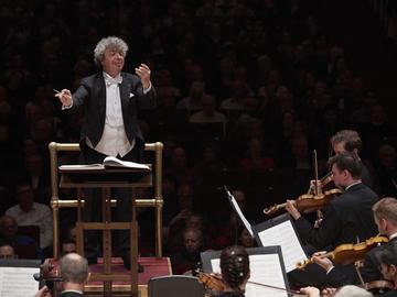 A man conducts an orchestra