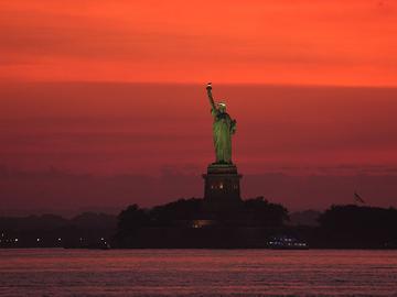 A view of the Statue of Liberty seen from New Jersey, United States as a dangerous heat wave sweeps across the region on June 23, 2025.
