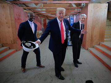  U.S. Sen. Tim Scott (R-SC), President Donald Trump and Federal Reserve Chair Jerome Powell tour the Federal Reserve’s $2.5 billion headquarters renovation project on July 24, 2025 in Washington, DC. 