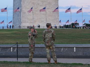 National Guard troops walk along the National Mall on August 12, 2025 in Washington, DC.