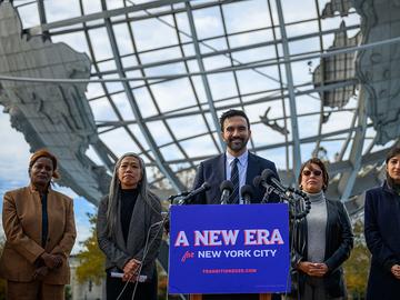 Mayor-elect of New York City Zohran Mamdani (C) stands alongside members of his transition team, (L-R) Transition Co-chairs Melanie Hartzog, Maria Torres-Springer, Grace Bonilla and Lina Khan as he sp
