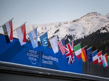 A sign of the World Economic Forum (WEF) is seen on the top of the Congress Centre that hosts the WEF annual meeting in the Alpine resort of Davos on its opening day in Davos on January 19, 2026. 