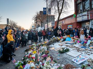  People pay their respects at a memorial site for Alex Pretti on January 25, 2026 in Minneapolis, Minnesota.