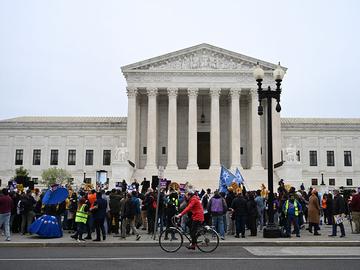 Members of the National TPS Alliance rally at the US Supreme Court in Washington, DC, on April 29, 2026. The Supreme Court is examining the revocation of Temporary Protected Status (TPS) for Haitian a