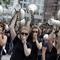 Women hold up megaphones during a protest against the G-20 summit in Hamburg, northern Germany, Saturday, July 8, 2017. 