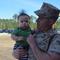 Sargeant holds his son