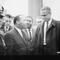 Martin Luther King and Malcolm X waiting for press conference
