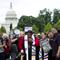 In this Saturday, June 23, 2018 file photo, Rev. Dr William Barber II accompanied by Rev. Dr. Liz Theoharis and Rev. Jesse Jackson speaks to the crowd outside of the U.S. Capitol.