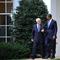 US President Barack Obama (R) walks with Palestinian Authority President Mahmoud Abbas to a waiting motorcade after their bilateral meeting on September 1, 2010 at the White House