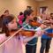 children playing violins in class