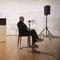 Alvin Lucier performing 'I Am Sitting in a Room' at the Museum of Modern Art, New York on Dec. 20, 2014