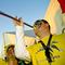 men blowing vuvuzela horns at the 2010 World Cup