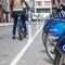 A woman checks a bike out from a Citi Bikes station in lower Manhattan.  