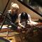 Composer/pianist Kelly Moran and pianist Margaret Leng Tan prepare the piano