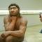 A photographer taking pictures of the Neanderthal man ancestor's reconstruction, displayed in a show of the Prehistoric Museum in Halle, eastern Germany.