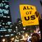  A woman attends a rally calling on greater social equality, organized by non-unionized fast food workers demanding for a wage raise from $7.25 per hour to $15.00 per hour.