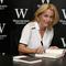  Gillian Anderson signs copies of her new book 'Vision of Fire' at Waterstone's, Piccadilly on October 3, 2014 in London, England.
