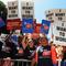 Americans hold up 'I want to work' placards as they join a protest of several thousand people demanding jobs outside City Hall in Los Angeles on August 13, 2010. 
