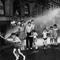 Children cool down in the spray from a fire hydrant during a hot summer on New York's Lower East Side