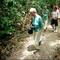 Tourists walk along a trail on an island in the Rio Negro River in the Amazons near Manaus, Brazil