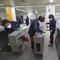 Employees disinfect ticket gates in hopes to prevent the contraction of the coronavirus at a subway station in Seoul, South Korea, Tuesday, Jan. 28, 2020. 
