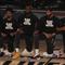 Los Angeles Lakers' LeBron James, second from left, wears a Black Lives Matter shirt and kneels with teammates during the national anthem prior to an NBA basketball game against the LA Clippers.