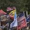 Flags and banners line the street outside of the campaign rally where President Donald Trump will speak at a rally, Thursday, Sept. 24, 2020, in Jacksonville, Fla.