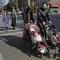An ultra-Orthodox Jewish man and woman wheel strollers with sleeping children in them as they cross a street on the Jewish holiday of Sukkot, Sunday, Oct. 4, 2020, in Borough Park, Brooklyn.
