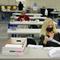 Linda Aftab works with other seasonal Board of Election employees to prepare mail-in ballots for counting in Linden, N.J., Thursday, Oct. 29, 2020. 