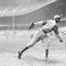 In this Aug. 2, 1942, file photo, Kansas City Monarchs pitcher Leroy Satchel Paige warms up at New York's Yankee Stadium before a Negro League game between the Monarchs and the New York Cuban Stars.