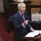 In this April 8, 2020 photo, Arkansas Gov. Asa Hutchinson gives the State of the State in the senate chamber of the state Capitol in Little Rock, Ark. 