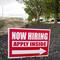Hiring signs are posted outside a gas station in Cranberry Township, Butler County, Pa., Wednesday, May 5, 2021.