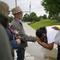 Lady Freedom, center, of Birmingham, Ala., cries as she holds hands with John Shafer of Tulsa, Okla. as they speak at a memorial for the Tulsa Race Massacre near the historic Greenwood district during