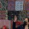 Vice President Kamala Harris gestures in front of traditional textiles as she attends a meeting with Guatemalan women entrepreneurs at the Universidad del Valle de Guatemala, in Guatemala City, Monday