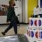 A poll worker assembles a ballot at Frank McCourt High School, in New York, Tuesday, June 22, 2021.