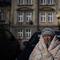 A Ukrainian woman waits at Przemysl train station, southeastern Poland, on Friday, March 11, 2022.