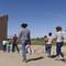 A group of Brazilian migrants make their way around a gap in the U.S.-Mexico border in Yuma, Ariz., seeking asylum in the U.S. after crossing over from Mexico, June 8, 2021. 